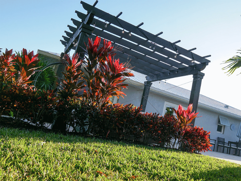 Pops of red Creative flora designs in Naples by Executive Lawn Care