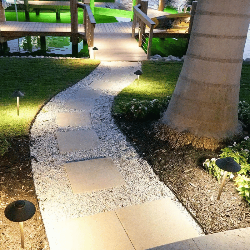 Elegantly lit pathway Landscape lighting Professional estate landscaping in Naples by Executive Lawn Care